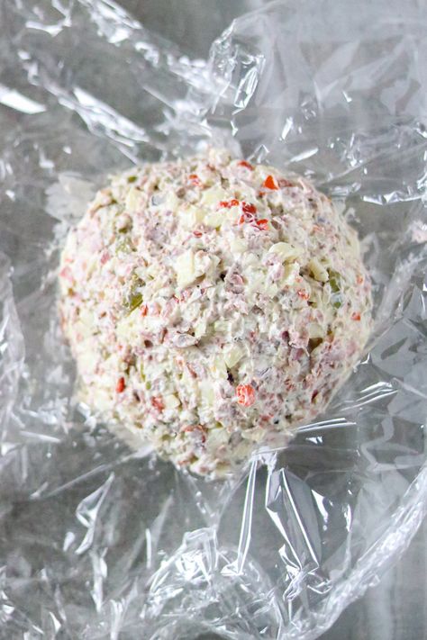 This Muffuletta Cheese Ball tastes like a classic New Orleans muffuletta sandwich. The flavors of salty olives, provolone cheese, and salami go well with cream cheese and Italian seasonings spread on a cracker. It's a quick and easy appetizer, snack food, or party food. Best Italian Dishes, Beef Olives, Muffuletta Sandwich, Appetizers Cheese, Cream Cheese Ball, Italian Seasonings, Mardi Gras Food, Quick And Easy Appetizers, Appetizers Recipes