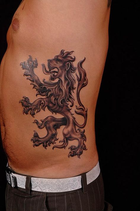 15 Meaningful Lion Tattoo Designs for Men and Women England Tattoo, Lion And Lioness Tattoo, Scotland Tattoo, Lion Tattoo Meaning, Lion Shoulder Tattoo, Oz Tattoo, Scottish Tattoos, Lion King Tattoo, Tattoo Lion