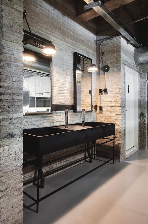 Industrial Office Features Exposed Bricks & Concrete Ceilings<span class="wtr-time-wrap after-title"><span class="wtr-time-number">2</span> min read</span> Vintage Industrial Bathroom, Industrial Bathroom Decor, Brick Bathroom, Industrial Bathroom Design, Urban Industrial Decor, Industrial Chic Decor, Modern Industrial Decor, Industrial Style Interior, Dining Room Industrial