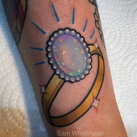 Opal ring tattoo Opal Tattoo, Eve Tattoo, Colored Tattoos, Colored Tattoo, Fresh Tattoo, Ring Tattoos, New School Tattoo, Girly Tattoos, Chest Piece