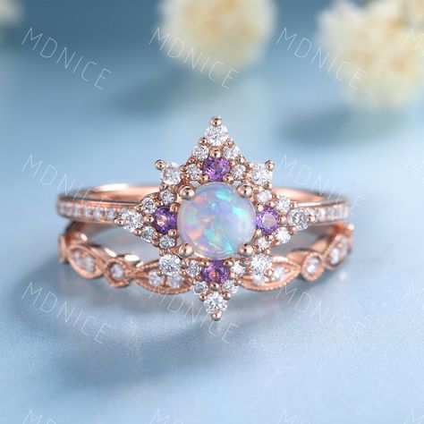 Vintage Opal Engagement Ring Set, Round cut Natural Opal Ring, Rose Gold Wedding Bridal Set, Opal Amethyst Ring, Stacking Ring, Gift for her Unique wedding set,perfect as engagement/wedding ring, birthday or anniversary gift, etc. Engagement Ring ❀gemstone is 5mm round cut Natural Opall❀ ❀ band stones :man made diamond stones,VVS Clarity,AAA + amethyst❀ ❀925 Sterling Silver,Rose/White/Yellow Gold Plated❀ ❀14/18k Solid White/Rose/Yellow gold❀ Wedding Band ❀ man made diamond stones,VVS Clarity,AAA Luxury Wedding Opal Ring With Stone Setting, Elegant Opal Crystal Wedding Ring, Opal And Amethyst Ring Engagement, Opal And Amethyst Wedding Ring, Opal And Amethyst Ring, Purple Opal Ring For Wedding, Moldavite Engagement Ring, Rose Gold Opal Engagement Ring Set, Vintage Opal Rings