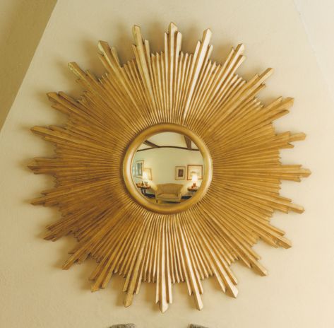 Bursts of fully sculpted antique gold leaf rays radiate a fiery light from an inner convex mirror. The sunburst signature of the French "Sun King" Louis XIV became a popular motif in Spain and throughout Latin America as well. Please note this mirror is available in two sizes (#35) 36" and (#36) 48". Wood Tile Floor, Gold Sunburst Mirror, Sunburst Wall Art, Sun Mirror, Starburst Mirror, Golden Decor, House Beautiful Magazine, Gilded Mirror, Gold Sunburst