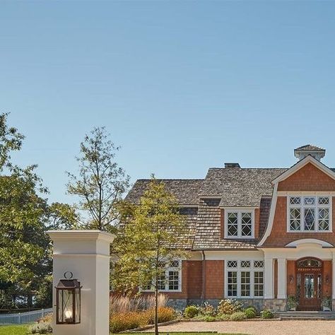 Purple Cherry Architects & Interior Design on Instagram: "In this Annapolis home, this classical shingle-style residence provides two well-balanced traditional elevations. The gambrel roofs, diagonal divided lites in the windows, capped oval windows, and a large eyebrow dormer create a delightful presence. Luxe finishes including a wood shake roof and copper accents exude a sense of elegance, which carries into the interior.⁠
⁠
Architecture: @purplecherryarchitects ⁠
Interior Designer: @purplecherryarchitects ⁠
Landscape Architect: @campionhrubyla⁠
Builder: @gychomes ⁠
Photographer: @david.burroughs.54 ⁠
⁠
⁠#purplecherryarchitects #design #architecture #architect #interiordesign #interiordesigner #designer #interiors #interior #designinspiration #homedesign #archilovers #architecturelovers Eyebrow Dormer, Oval Windows, Shake Roof, Oval Window, Gambrel Roof, Copper Accents, Landscape Architect, Design Architecture, Interior Designer