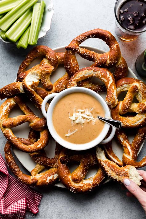 This lusciously creamy, salty, and smooth pub-style beer cheese dip is an easy appetizer recipe that's ready in 15 minutes. Flavored with lager-style beer, garlic, smoked paprika, a bit of dijon mustard, and lots of cheddar cheese, this robust dip is extra flavorful and awesome with soft pretzels, fresh bread, pitas, or celery. Recipe on sallysbakingaddiction.com Celery Recipe, Breakfast Recipes Kids, Beer Cheese Dip, Homemade Beer, Nacho Cheese Sauce, Homemade Soft Pretzels, Christmas Recipes Appetizers, Baked Cheese, Superbowl Snacks