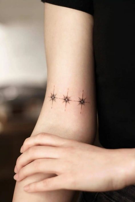 Stars represent hope, dream, and strength. They are the gemstones of the night. Their light reminds us of endless possibilities, something to… 3 Star Tattoo, 3 Stars Tattoo, Mother Of 3 Tattoo Ideas, Siblings Tattoo For 3, Star Tattoo On Shoulder, Shooting Star Tattoo, Small Star Tattoos, Small Neck Tattoos, Red Heart Tattoos