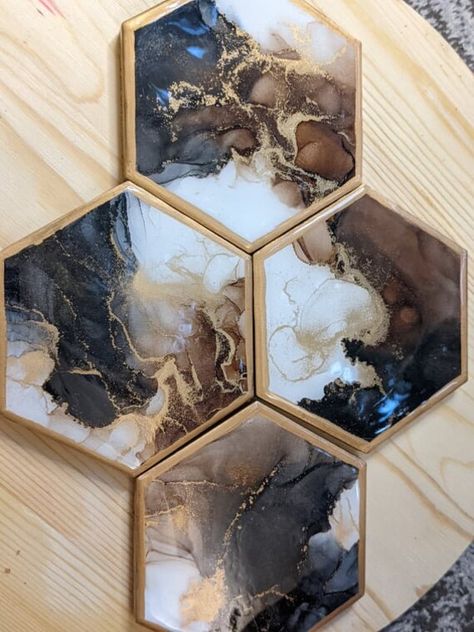 Thank you for your interest in my delicately handcrafted hexagon coasters! Perfect for gifts for any occasion, housewarming parties, or for your own home! The coasters are made with alcohol inks, then topped with resin for a glass like finish which allows for hot or cold beverages. As they are made by means of fluid art, no two will ever look the same. The coasters will have a cork backing to protect even the most delicate furniture. They come in a set of 4, however if you would like to add more Hexagon Resin Coasters, Alcohol Ink Trivets, Alcohol Ink Tiles, Amazing Resin, Alcohol Ink Crafts, Hexagon Coasters, Fluid Acrylic Painting, Resin Coasters, Ceramic Handmade