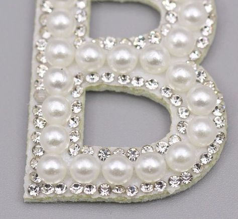 "PEARL & RHINESTONE ALPHABET LETTER PATCHES - No Glue Bottom - for DIY Crafts, Flatback for Apparel, School Supplies, Jewelry. This high quality, glinting rhinestone embellishment is mesmerizing. The front side of this is covered with shiny rhinestones embedded on a silver tone metal base. Crystals of different sizes are used to emphasize the classy curves of the letter. Don't just limit these bejeweled sparkles for basic embellishments; you can add these to your homecoming mums, flower arra Patch Letters, Rhinestone Alphabet, Type Alphabet, Embroidery Clothes, Alphabet Embroidery, Letter Patches, Pearl Letters, Rhinestone Letters, Pearl Pink