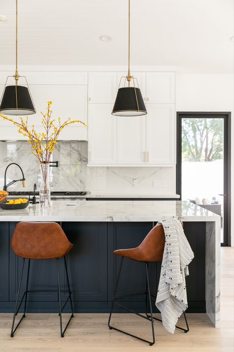 Blue Island With Waterfall Edge, Peninsula Waterfall Countertop, Black Island Grey Cabinets, Black Waterfall Island Kitchen, Waterfall Island With Seating, Kitchen Island Waterfall Edge, Black And White Kitchen Island, Rambler Renovation, Black Island White Cabinets