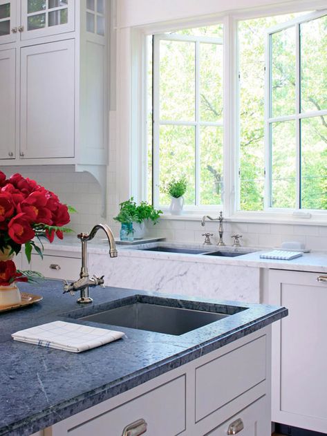 Incredible soapstone island countertop with prep sink breaks up all white kitchen. Prep Sink In Island, Soapstone Kitchen, Stone Countertops Kitchen, Sink In Island, Soapstone Countertops, Concrete Patios, Prep Sink, Small Kitchen Storage, Island Countertops