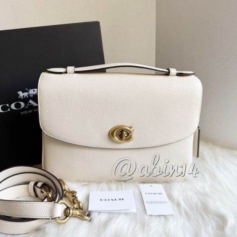 Nwt Coach Cassie Leather Crossbody Larger Size Bag This Is Very Desirable And Now Discontinued Cassie Leather Bag. This Is The Larger Size Of The Cassie. The Bag Is New With Packaging As Shown. The Tags Are Detached. Details Color- Chalk Approximate Dimensions- 10" (L) X 7 1/4" (H) X 1 3/4" (W) Material- Polished Pebble Leather Inside Zip And Multifunction Pockets Turnlock Closure, Fabric Lining Top Handle With 1 1/4" Drop Outside Slip Pocket Detachable Strap With 21 3/4" Drop For Shoulder Or Cr Coach Cassie, Polished Pebble, Black Gift Boxes, Pebbled Leather, Coach Bags, 4 H, Leather Crossbody, And Now, Top Handle