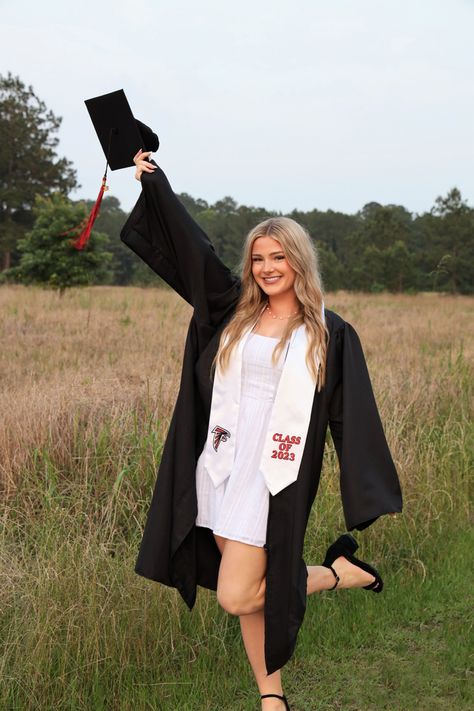 field, cap and gown, grad gown, diploma, grad pics, graduation, high school graduate, senior pics, senior photos, senior field pics, 2023, 2023 grad pics, 2024 grad pics, graduation, graduation dress, grad dress, white dress Grad Pics With Cap And Gown, Cape And Gown Senior Pictures, Graduation Pictures With Diploma, Field Graduation Photos, Senior Photos Cap And Gown, Senior Graduation Pictures High Schools, Senior Picture Ideas Cap And Gown, Girl Cap And Gown, Pretty Senior Pictures