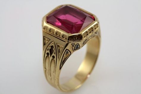 This magnificent men's ring is set with a large rectangular cut created ruby.  The ruby is approximately 11 carats and is in extremely good condition.  The 14K yellow gold setting is meticulously detailed, substantial in weight and finely finished.    Larter & Sons is one of America's oldest and finest jewelry manufacturers.  Founded in 1865, the firm became known for their exquisite line of finely crafted men's jewelry.   Experiments in producing synthetic rubies began in... Ruby Gold Ring For Men, Antique Mens Rings, Mens Ruby Ring, Cool Rings For Men, Medieval Rings, Bridal Necklace Designs, Mens Gemstone Rings, Mens Rings Fashion, Mens Rings