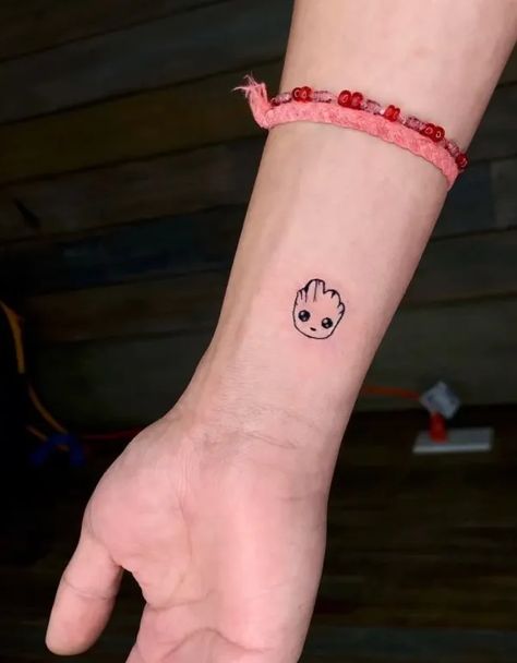 25 Awesome Baby Groot Tattoo Ideas In 2022 14 Groot Minimalist Tattoo, Tv Show Tattoos Minimalist, Marvel Small Tattoo Ideas, Marvel Mini Tattoo, Small Tattoos Marvel, Cool Marvel Tattoos, Marvel Rocket Tattoo, Groot Tattoo Small, Matching Tattoos Marvel