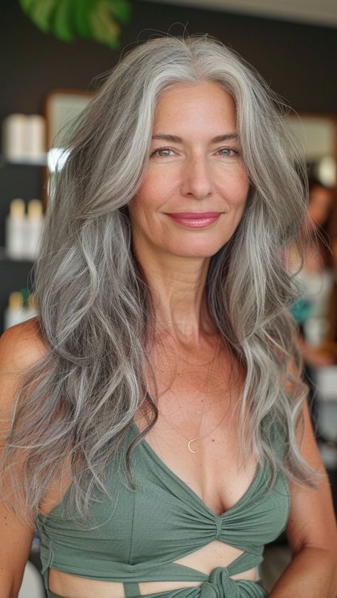 More and more women are embracing their natural gray hair and experimenting with stunning long hairstyles that showcase their silver strands. Whether you’re transitioning to gray hair, have fully embraced your silver strands, or simply