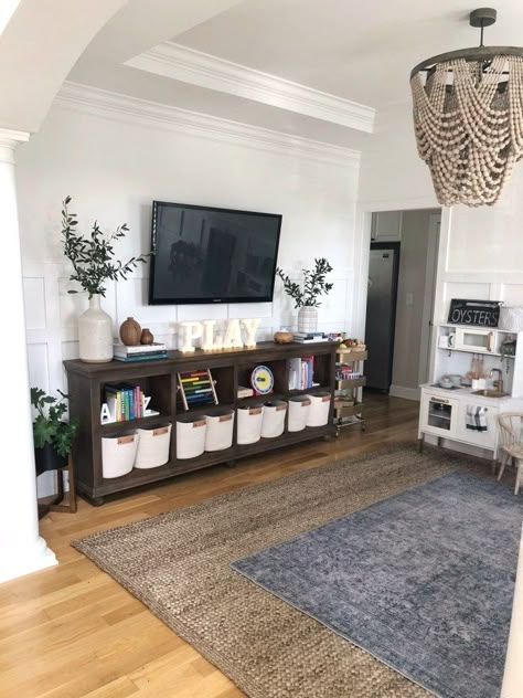 Small Toy Shelf In Living Room, Shared Living Room Playroom, Living Room And Playroom Combo Ideas, Playroom And Living Room Combo, Playroom Family Room Combo, Playroom Tv Room Combo, Playroom Living Room Combo, Living Room Playroom Combo, Living Room Play Area