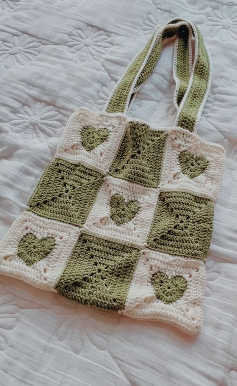 #totebag #knitting #crochet #bag #sage #green #heart #aesthetic Green And White Crochet Bag, Crochet Granny Square Bag Aesthetic, Crochet Totebag Aesthetic, Crochet Sage Green, Dark Green Crochet Bag, Green Bag Crochet, Knit Ideas Aesthetic, Crochet Ideas Aesthetic Bag, Knitted Bags Aesthetic