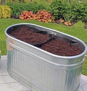 Smart Pots make great liners for large containers. Here a Metal Trough Planter, Garden Troughs, Water Trough, Trough Planters, Garden Services, Container Gardening Vegetables, Garden Containers, Veggie Garden, A Metal