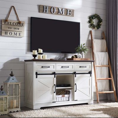 Bedroom TV Stand for 60 Inch TVs, Brown Color: White | Gracie Oaks Vasilike 54 W Storage Credenza Wood in White | 34.1 H x 54 W x 16 D in | Wayfair Tv Stand Decor Ideas, Bedroom Tv Stand, Modern Farmhouse Living Room Decor, Farmhouse Tv, Tv Stand Decor, Farmhouse Tv Stand, Bedroom Tv, Tv In Bedroom, Modern Farmhouse Living Room