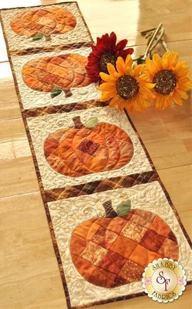 Patchwork Pumpkin Table Runner Kit | Shabby Fabrics Patchwork Pumpkin, Crocheted Dolls, Pumpkin Table Runner, Runner Pattern, Quilted Table Runners Patterns, Snow People, Fabric Table Runner, Fall Table Runners, Dresden Plate