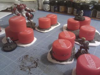 Barrels made from bottle caps. Infinity - How much terrain do you need? | Warhammer 40k, Fantasy, Wargames & Miniatures News: Bell of Lost Souls Infinity Terrain, Dnd Crafts, Dnd Minis, Infinity The Game, Dice Bags, Warhammer Terrain, 40k Terrain, Game Terrain, Mixed Media Crafts