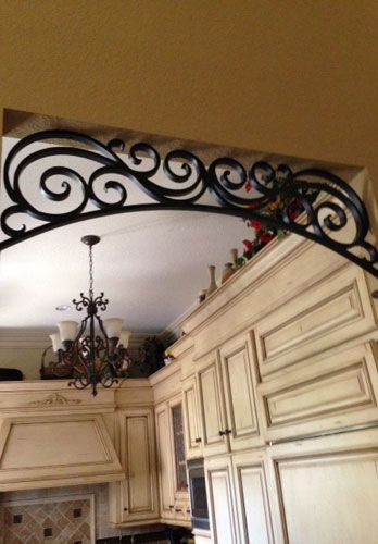 This homeowner in Orange, CA wanted Angels Ornamental Iron to create a custom wrought iron arch in the entrance to this kitchen. This wrought iron scroll ... Iron Arch, Wrought Iron Design, Wrought Iron Decor, Iron Balcony, Tuscan Design, Tuscan Kitchen, Diy Kitchen Decor, Tuscan Decorating, Iron Wall Decor