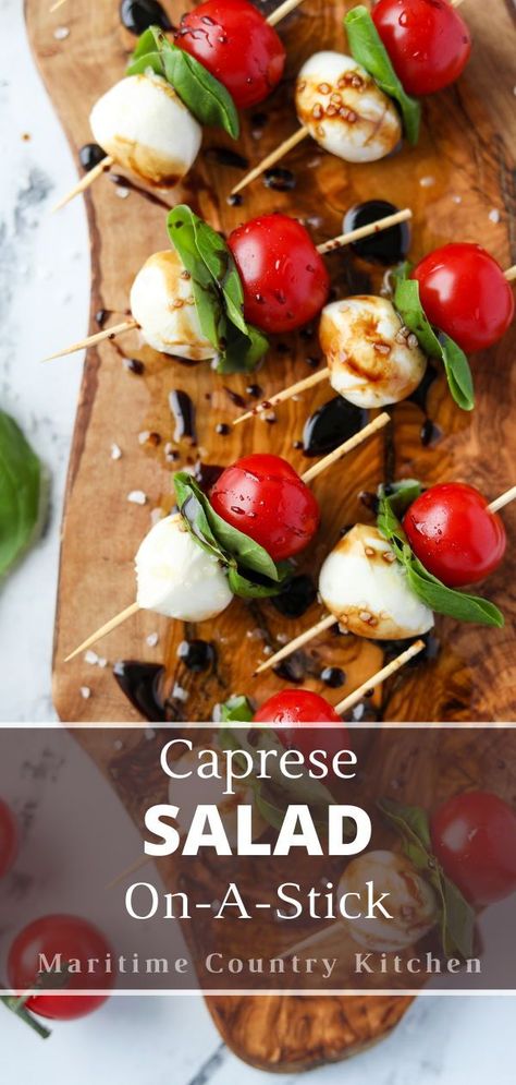 This easy recipe for Caprese skewers features all of the flavor of Caprese salad - but on a stick!Featuring juicy cherry tomatoes, creamy mozzarella balls, and aromatic basil, this fun appetizer is both fancy and flavorful. Caprice Salad Tomato Mozzarella Caprese Skewers, Charcuterie Board Caprese, Mozerella Tomato Skewers, Classy Wedding Appetizers, Caprese On A Stick, Tomato Basil And Mozzarella Appetizers, Cherry Tomatoes Appetizers, Tomato Mozarella Appetizer Ideas, Recipes With Fresh Mozzarella Balls