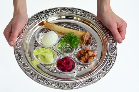 10  completely secular reasons to appreciate the foods on the Passover seder plate. If you’ve ever been to a Passover Seder there is good chance you noticed the signature centerpiece on the table: the seder plate. The decorative plate designates a spot for 5 symbolic foods: beitzah, the hard-boiled egg zeroa, the lamb shank bone … Passover Images, Passover Recipes Dessert, Passover Holiday, Seder Meal, Boneless Leg Of Lamb, Matzah Ball, Chopped Liver, Passover Seder Plate, Woman Hands