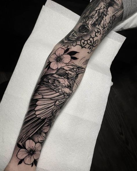 Explore 60+ unique and spiritual raven tattoo designs with meaningful explanations gathered in our article. Choose one that suits your character the best! Raven Tattoo Feminine Arm, Raven Tattoos, Tattoos Masculinas, Rabe Tattoo, Wolf Tattoo Sleeve, Feminine Tattoo Sleeves, Saved Tattoo, Tattoo Meanings, Bird Tattoos