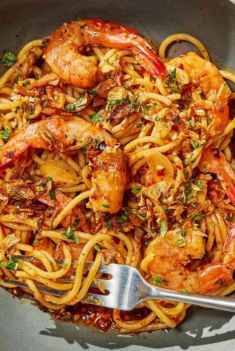 This shrimp scampi pasta recipe gets extra spice from chili crisp and crunch from fried onions for an easy weeknight dinner. Spicy Shrimp Scampi Pasta, Chili Crisp Shrimp, Fried Shrimp Pasta, Chili Crisp Pasta, Recipes Using Chili Crisp, Recipes With Chili Crisp, Chili Onion Crunch Recipes, Chili Shrimp Pasta, Chili Crunch Recipe