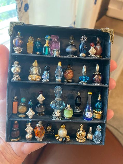 Witchy Miniatures Diy, Jewelry Making Organization Ideas, Miniature Glass Bottle Crafts, Diy Miniature Bookshelf, Diy Outlet Covers Ideas, Cabinet Of Curiosities Diy, Witchy Trinkets, Trinket Ideas, Mini Trinkets