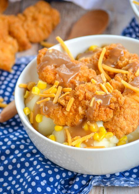 A homemade version of Kentucky Fried Chicken's Famous Bowls, these copycat KFC Famous Bowls are a winner. Crispy chicken and sweet corn sits on top of creamy mashed potatoes. It's a bowl of comfort food with that classic KFC taste without ever having to leave your house. Kfc Gravy Recipe, Kfc Mashed Potatoes, Kfc Famous Bowl, Copycat Kfc, Kfc Coleslaw Recipe, Homemade Chicken Tenders, Kfc Chicken Recipe, Chicken Mashed Potatoes, Chicken Bowl Recipe