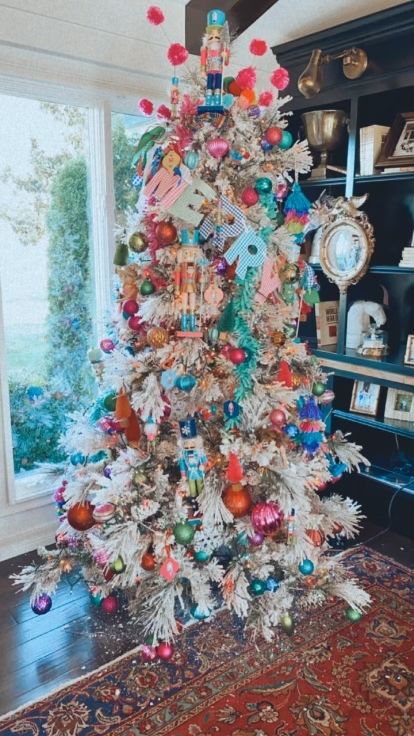 White Christmas Tree With Colorful Decor, Bright Colorful Christmas Tree, Glitterville Christmas Tree, Colorful Flocked Christmas Tree, Christmas Tree Nutcracker Theme, Maximalist Christmas Tree, Nutcracker Themed Christmas Tree, Christmas Tree Themes 2024, The Nutcracker Christmas Tree