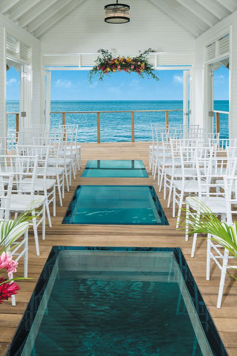 Yep, you can now marry here! Perched over the crystal clear waters of the Caribbean Sea is the Serenity Chapel at Sandals Ochi Beach Resort in Jamaica. Destination wedding ideas don't get more romantic than this. If you're thinking of a wedding abroad, find out more about this incredible wedding chapel and other destination wedding venues on Hitched. Sandals Ochi Beach Resort, Sandals Ochi, Winter Wedding Destinations, Jamaica Resorts, Jamaica Wedding, Unusual Wedding, Caribbean Wedding, Wedding Venues Beach, Wedding Chapel