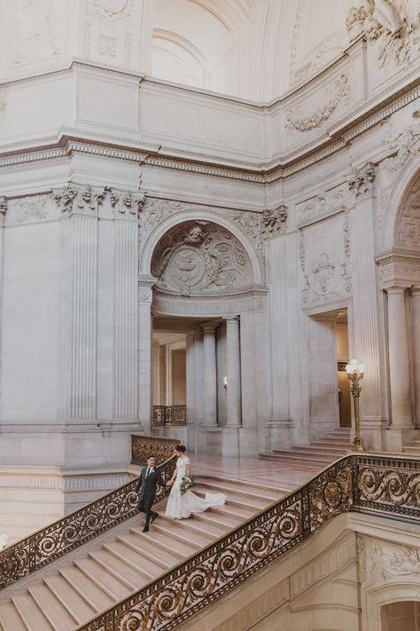 groom leads bride down san francisco city hall staircase on Wedding day California City Hall Wedding, City Hall San Francisco, School Castle, Sf City Hall Elopement, City Hall Wedding Dress, City Hall Wedding Photography, City Hall Wedding Photos, San Francisco City Hall Elopement, Pasadena City Hall