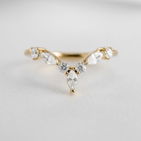 With a captivating combination of marquise and round diamonds, the Jaden wedding band elevates your bridal stack. Taking the classic wishbone wedding ring style to new heights, his show-stopping design is the perfect complement to round, oval, pear, or marquise engagement rings. With its alternating marquise and round-cut diamonds, the Jaden creates an eye-catching and glamorous silhouette. The vertical-set marquise diamond crowns the ring with a stunning, elongated finish. And if you don't have Pear Ring With Crown Band, Marquise Wedding Ring With Band, Wedding Band Marquise Ring, Wedding Bands With Marquise Ring, Wedding Band With Marquise Engagement, Marquise Wedding Stack, Pointed Wedding Band, Marquise Stack, Marquise Engagement Rings