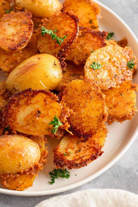 Crispy Parmesan Crusted Potatoes that are perfect for any meal! Discover this easy roast potato recipe with a delicious parmesan crust. Try our homemade parmesan potatoes for the ultimate potato recipe experience. Crusty Potatoes, Parmesan Potatoes Baked, Parmasean Potatoes, Crispy Parmesan Roasted Potatoes, Crispy Parmasean Potatoes, Extra Crispy Parmesan Crusted Potatoes, Crispy Crunchy Parmesan Potatoes Recipe, Parmesean Roasted Potatoes, Crispy Herb Roasted Parmesan Potatoes