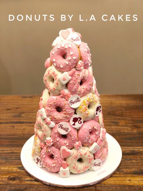 Barbie theme donut tower Barbie Donut Cake, Donut Cake Birthday Tower, Mini Donut Tower, Donut Tower Cake, Donat Tower, Donut Towers, Doughnut Tower, Foxy Plush, Half Birthday Cakes