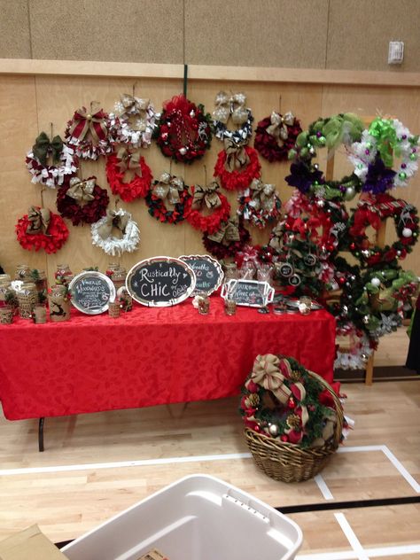 Wreaths galore. 2013 Christmas craft fair. Wreath Craft Fair Booth, Craft Fair Booth, Wreath Display, Christmas Candle Rings, Market Vendor, Vendor Booth Display, Craft Fair Booth Display, Fair Theme, Craft Show Booth