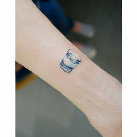 A realistic and small glass of water tattoo Glass Of Water Tattoo, Alcohol Tattoo, Rebirth Tattoos, Jade Tattoo, Woman In Water, Miniature Tattoos, Beer Tattoos, Chef Tattoo, Glass Tattoo