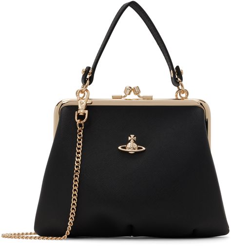 Saffiano faux-leather top handle bag in black. · Detachable carry handle · Detachable curb chain crossbody strap · Logo hardware at face · Kiss-lock closure · Zip pocket at interior · Twill lining · Gold-tone hardware · H6 x W7 x D2.5 Supplier color: Black Vivienne Westwood Purse, Vivienne Westwood Bags, Faux Leather Top, Purse Handles, Gold Bag, Frame Bag, Cute Purses, Black Chain, Black Purses