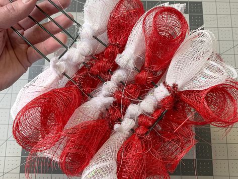 Learn how to make this a candy cane mesh wreath the easiest way possible! This candy cane deco mesh wreath is perfect for your Christmas decor. Deco Mesh Wreaths Tutorials Christmas, Candycane Deco Mesh Wreath Diy, Mesh Candy Cane, Mesh Candy Cane Wreath, Deco Mesh Candy Cane Wreath Tutorial, Candy Cane Mesh Wreath Diy, Mesh Candy Cane Wreath Tutorial, Metal Candy Cane Wreath Diy, How To Make A Candy Cane Wreath