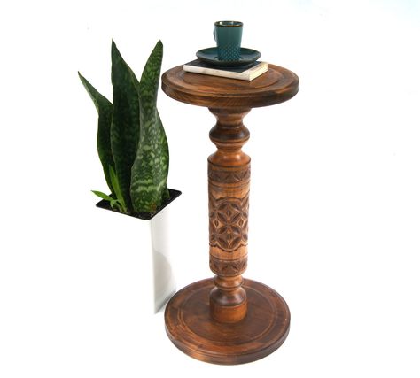 This luxury turned column coffee table is handcrafted using solid natural wood. The table's leg was made in the pedestal form and decorated with hand carving, and the round base is very stable and sturdy. Dimensions: Height - 25 1/4 inches / 64 cm Diameter of the top - 11 inches / 28 cm Diameter of the base - 13 3/4 inches / 35 cm Weight - 8.8 lb / 4.2 kg READY TO SHIP! OUR SHOP IS WORKING AS USUAL. The parts of the table are machined on a lathe.  Then the wooden coffee table was covered by professional oil, silky to the touch.  Other live edge wood coffee tables - https://www.etsy.com/shop/UnusualThingsbyOlga?ref=hdr_shop_menu&section_id=20268208 Wooden plant stands - https://www.etsy.com/shop/UnusualThingsbyOlga?ref=seller-platform-mcnav&section_id=19213300 My shop - https://www.etsy.com Round Hallway, Wood Entryway Table, Hallway Stand, Table Column, Side Table Round, Round Wood Side Table, Wood Entryway, Wooden Plant Stands, Wood Side Table