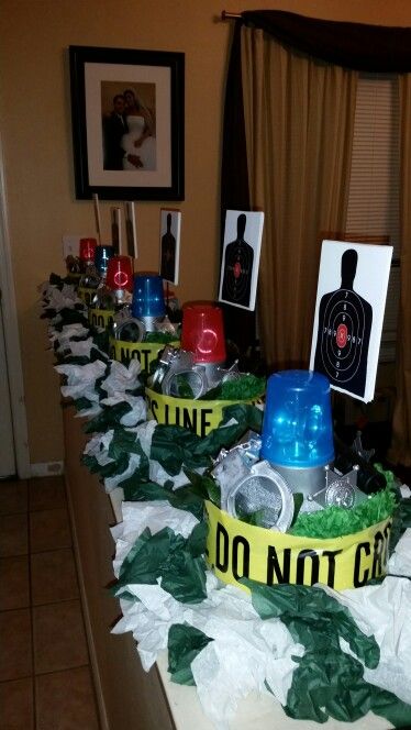 Centerpieces for my dad's retirement party (retired sheriff deputy ) Deputy Sheriff Wedding Ideas, Police Theme Graduation Party, Law Enforcement Centerpiece Ideas, Police Bachelorette Party, Police Cadet Graduation Party, Police Academy Graduation Party Centerpieces, Police Retirement Party Centerpieces, Deputy Sheriff Graduation Party, Sheriff Party Ideas Deputy