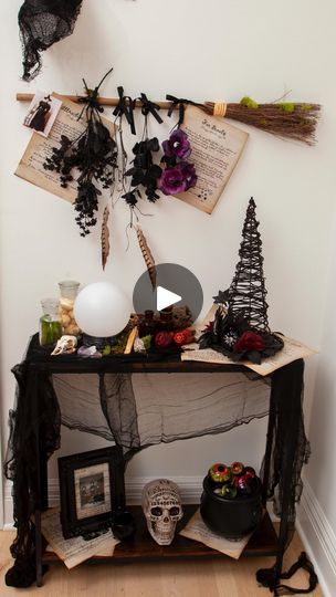 615 reactions · 77 shares | Let’s set up a Witch  Themed Entry Way table!  🧙🏻‍♀️🐈‍⬛ I used pages of spells, potions and ingredients hanging from a broom, to create a table that has everything a witch needs to make magic!  I also added pictures of witches for a lived in feel…witchy ancestors! 🧙🏻‍♀️🐈‍⬛ My favorite new witchy finds were the crystal ball which lights up and makes spooky sounds as well as the gorgeous wicker hat, a Boo Boutique find for under $20 @orientaltrading 🧙🏻‍♀️🐈‍⬛🧪 Drop a “SPELL” in the comments if you’d like my supplies list, including this side table I found for $30! and the printables I used. #halloweenthemes #halloweendecor #witchdecor #i doorhalloweendecor #halloweendecor #halloweenentryway | Natalie Mayhew | Alan Silvestri · Practical Magic Practical Magic Party Ideas, Pictures Of Witches, Witch Table Decor, Wicker Hat, Halloween Entryway, Entry Way Table, Witch Pictures, Magic Party, Dinner Party Table