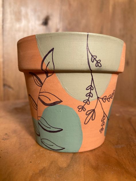 Hand painted one of a kind boho terracotta clay planter pot. Great for personal use to make your home look beautiful or wonderful to give as a gift to the plant lover in your life. Each pot is painted with acrylic water based paint and sealed with a matte sealer on the outside and inside. Each pot is unique. While pots will be similar to what is pictured, I cannot guarantee pots will be identical.  Let me know if you are interested in another size that is not listed and I will gladly paint one f Hand Painted Flower Pots Terracotta, Paint Ideas For Flower Pots, Acrylic Boho Painting, Painted Pots Diy Terra Cotta, Painting Terra Cotta Pots, Terracotta Pot Painting, Hand Painted Terra Cotta Pots, Terracotta Pots Painted, Plant Pot Painting Ideas