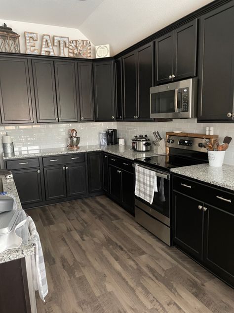 Black Cabinet In Kitchen, Kitchen Flooring Ideas Black Cabinets, Grey Floors Black Cabinets, Black Cabinets Gray Floor, Black Cabinets With Silver Hardware, Black Kitchen Cabinets Decor Ideas, Black Cabinets Kitchen Ideas, Grey Walls Black Cabinets, Kitchen Decor Grey Cabinets