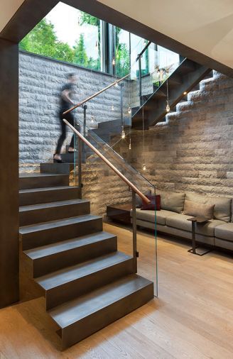 The modest amount of space dedicated to the stair well could have felt hemmed in and claustrophobic with an enclosed staircase, so Jill designed an open-tread stair system to keep the space feeling light and airy. Narrow windows on the landing offer peekaboo views. Stairs Modern, Canadian House, Estate Gardens, Stair Well, Metal Steps, Glass Stairs, Steel Stairs, Spirit Art, Stairs Design Modern