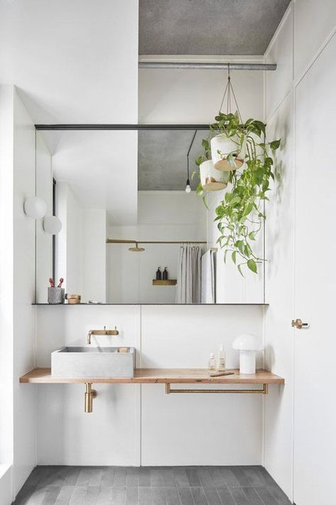 To inspire your next remodel with their minimal palettes, clean lines, and modern designs, here are 10 Scandinavian bathroom ideas that prove sometimes less really is more. #hunkerhome #scandistyle #scandinavianbathroom #bathroom #minimalist Bohemian Bathroom, Bathroom Storage Solutions, Australian Interior Design, Scandinavian Bathroom, Bad Inspiration, Interior Minimalista, Interior Design Awards, Interior Plants, Boho Bathroom