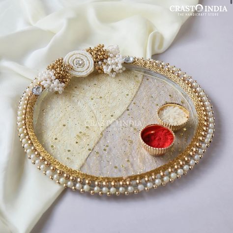 Add a touch of tradition and grace to your festive rituals with our handcrafted Pooja platters. Perfect for Ganpati, Diwali, Karwa Chauth, and more, these platters bring a sacred charm to your celebrations. Order now to make your festivities truly special! Rakshabandhan Thali Decoration, Prabodh Swami, Akshay Tritiya, Aarti Thali, Ring Platter, Wedding Platters, Thali Decoration, Acrylic Rangoli, Thali Decoration Ideas