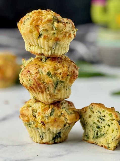 Spinach and cheese muffins on a stack with one cut in half on the side. Spinach Muffins, French Toast Roll Ups, Blueberry Oat, Raw Spinach, Bakery Style Muffins, Cheese Muffins, Chocolate Banana Muffins, Oat Pancakes, Cheese Biscuits